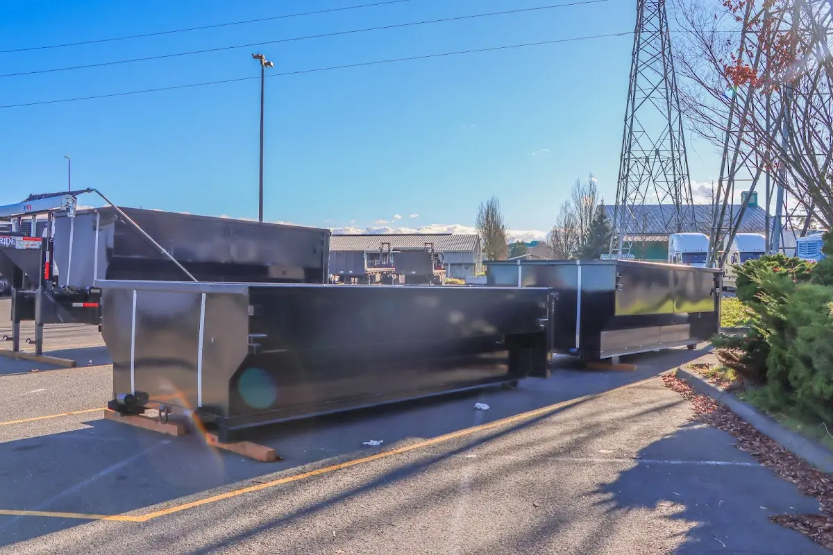 Roll-off dumpster ready for waste disposal at job site for 2 Yard Dumpster Rental in Selma